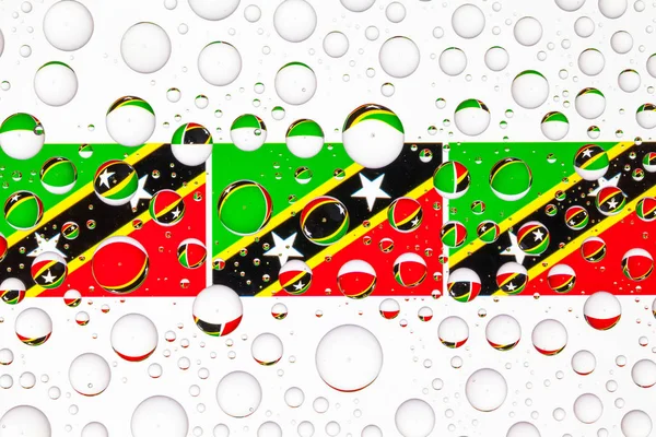 Флаги Сент Китса Невиса Стеклом Покрытым Каплями Дождя Иллюстрация — стоковое фото