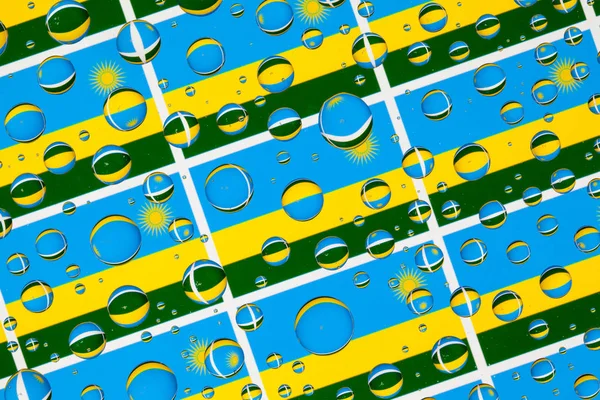 Flags  of Rwanda, behind a glass covered with rain drops.Pattern from Rwanda flags. 3D illustration