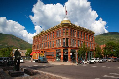 Aspen,USA - July 17,2013: On the street in Aspen. Aspen, in Colorados Rocky Mountains, is a ski resort town and year round destination for outdoor recreation. clipart