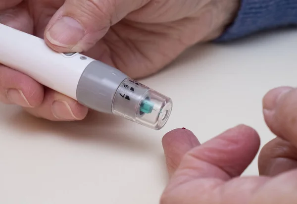 Diabetes Type Home Monitoring Using Fing Prick Blood Test — Stock Photo, Image