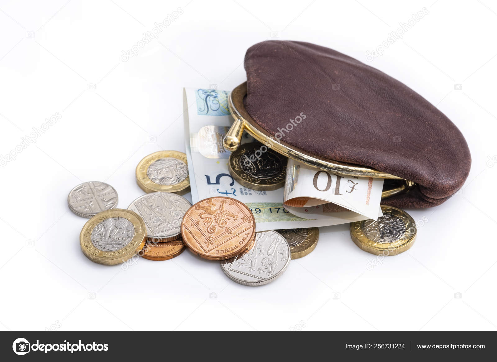旧钱包中的英国货币英镑硬币小硬币和纸币的混合物在钱包里溢出——图库图片© Cwyfan #256731234