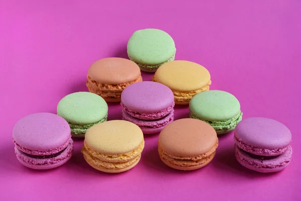 Triangle Multicolored Macaroons Fucsia Background — Stock Photo, Image