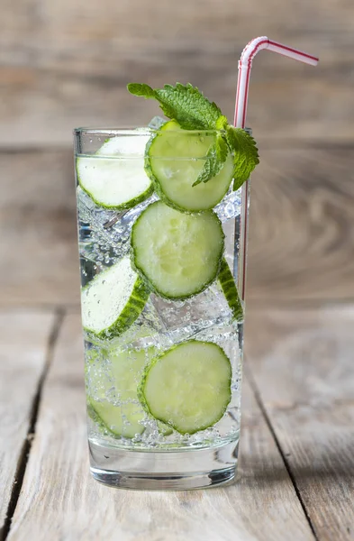 Cold fresh lemonade with cucumber, ice, mint and cocktail tube — Stock Photo, Image