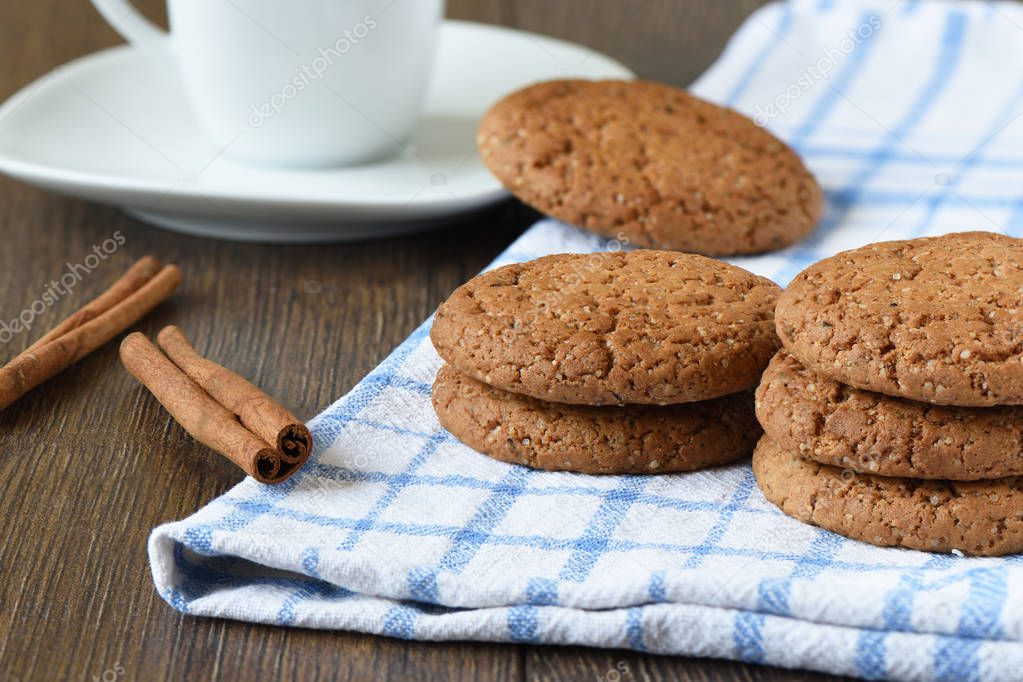 Oatmeal cookies, cinnamon and a cup of coffee.