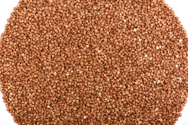 Vista dall'alto. Grano saraceno su sfondo bianco. Texture di grano saraceno — Foto Stock