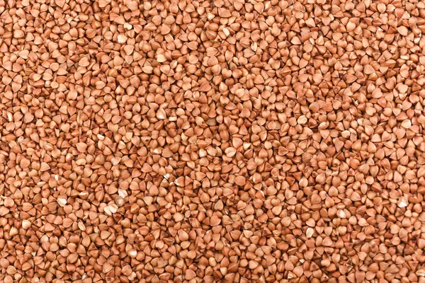Fondo di chicchi di grano saraceno. Texture di grano saraceno. Da vicino. — Foto Stock