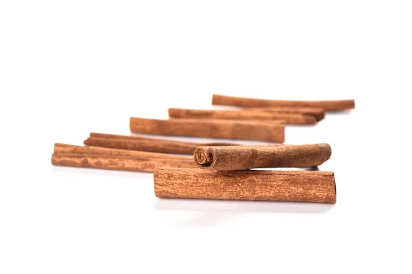 Soft focus. A few cinnamon sticks isolated on white background. Spice concept — Stock Photo, Image