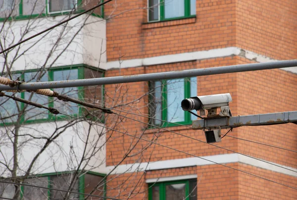 Outdoor video camera with motion sensor under it.