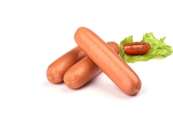 Three fresh boiled sausages with lettuce and a tomato isolated on white background — Stock Photo, Image