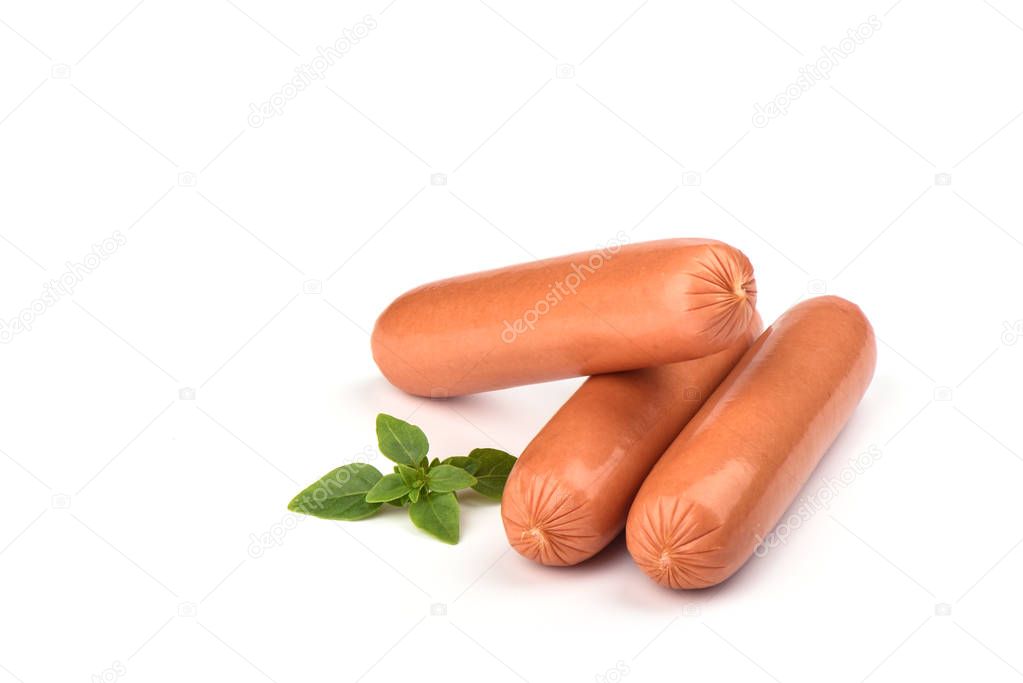 Three fresh boiled sausages with basil isolated on white background
