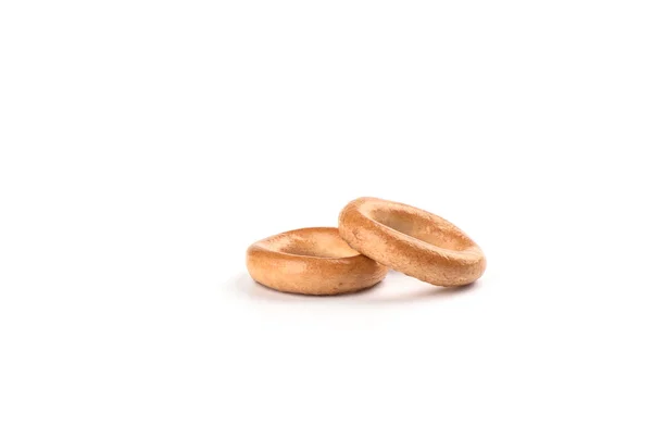 Two crispy bagels isolated on white background. — Stock Photo, Image