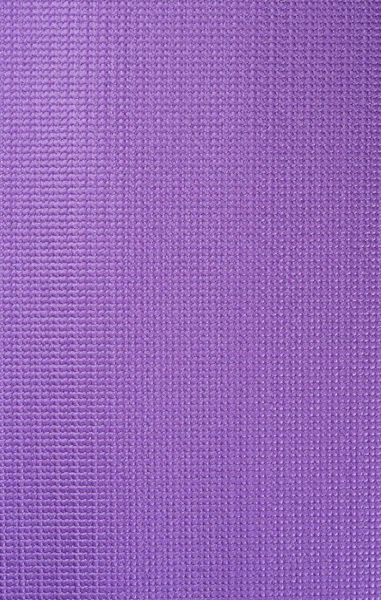 Textura de um tapete de ginástica violeta. Yoga esteira textura . — Fotografia de Stock