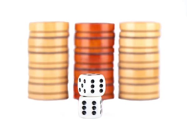 Several checkers and dice on isolated over white background. — Stock Photo, Image