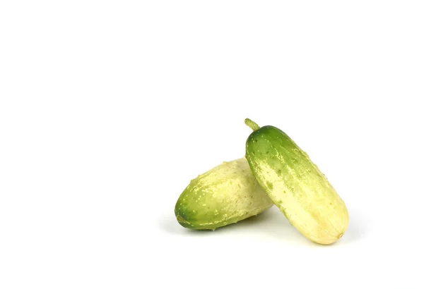 Two organic small cucumbers isolated on white background. — ストック写真