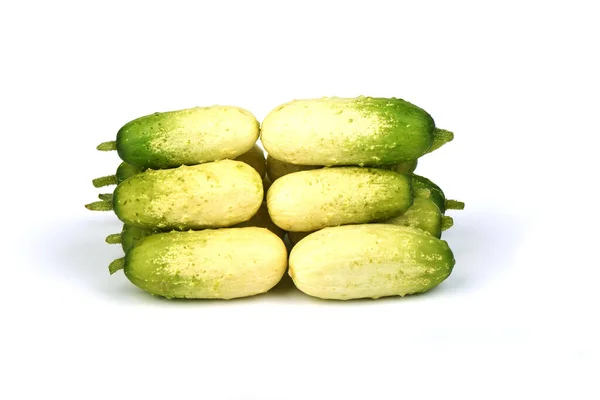 Several organic small cucumbers isolated on white background. — ストック写真