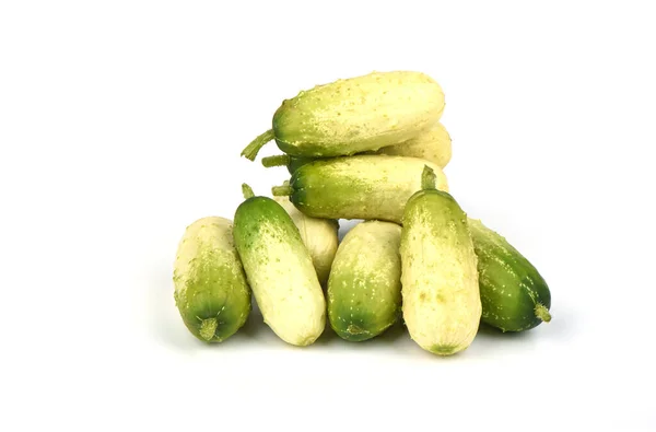 Several organic small cucumbers isolated on white background. — ストック写真