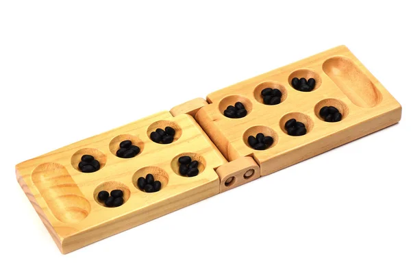 Stones and wooden folding board for playing mancala.