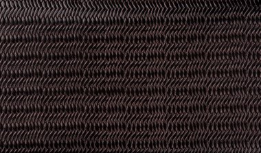 Kabartmalı arkaplan dokusuyla kahverengi sentetik deri. Kahverengi yapay deri arka plan. Kapatın. Boşluğu kopyala.