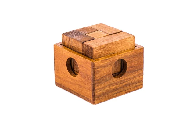 Wooden puzzle cube 7 in an open wooden container. — Stock Photo, Image