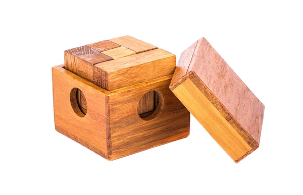 Wooden puzzle cube 7 in an open wooden box with a lid. — Stock Photo, Image