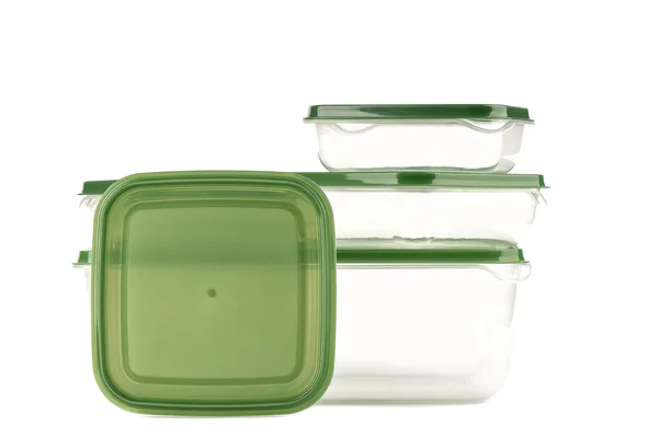 Transparenta plastbehållare med grönt lock isolerad på en vit bakgrund. — Stockfoto