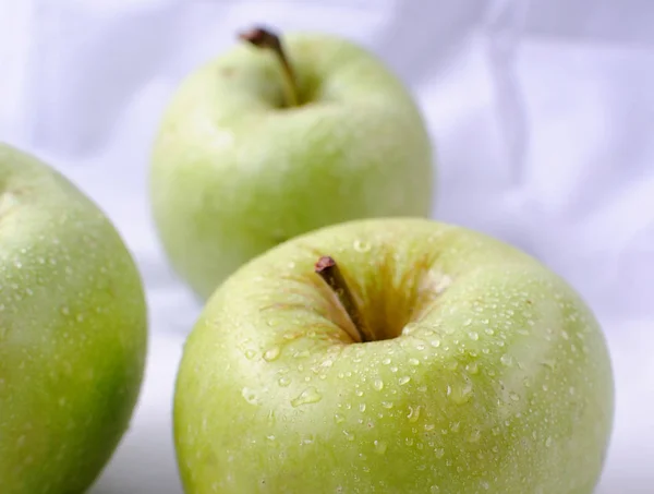 Green apple on a white background