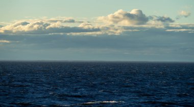 Small waves in the sea at sunset