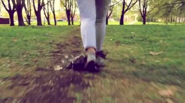 Woman litter in the Park, throws plastic things on the grass