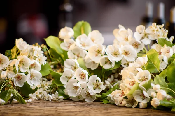 Branch of jasmine on a wooden table. close-up — Stock Image Branch of jasmine on a wooden table. close-up Stock Picture