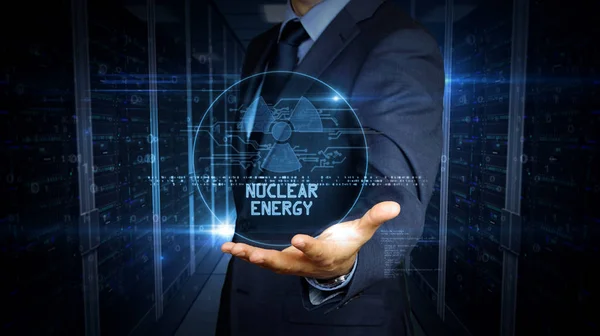 Touch screen uomo d'affari con ologramma simbolo di energia nucleare — Foto Stock