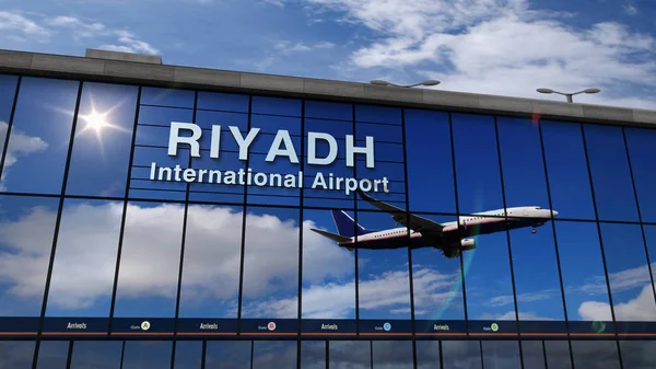 Посадка самолета в Эр-Рияде отражается в терминале — стоковое фото