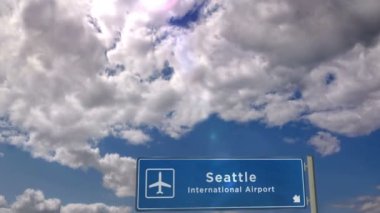 Jet uçağı Seattle, Washington, Usa 'ya iniyor. Havaalanı istikameti işaretli şehir gelişi. Seyahat, iş, turizm ve ulaşım kavramı.
