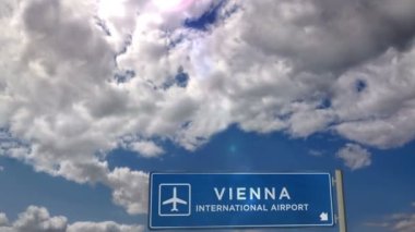 Jet uçağı Viyana, Avusturya 'ya iniyor. Havaalanı istikameti işaretli şehir gelişi. Seyahat, iş, turizm ve ulaşım konsepti. 3B canlandırma canlandırması.