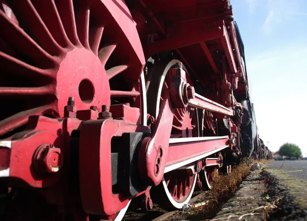 Red vintage train wheels. Retro locomotive part.