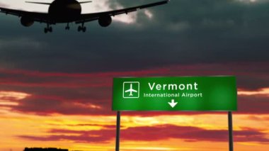 Vermont, ABD 'ye uçak silueti iniyor. Havaalanı yön tabelasıyla ve arka planda gün batımıyla uçaklar geliyor. Seyahat, seyahat ve ulaşım 3D konsepti.