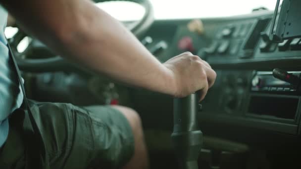 Dump Truck Driver in The Wheel en shift gear — Stockvideo