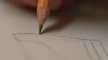 Mens elleri kalem kağıt üzerinde çizin. bir tasarım oluşturur kadar yakın