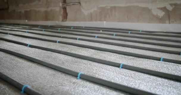 Underfloor heating pipes for water heating. Heating systems. Slide camera — Stock Video