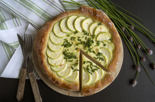 Homemade rustic pie with zucchini and green onions