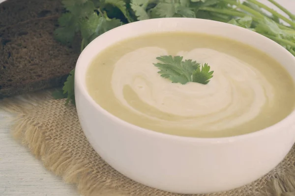 Homemade diet mushroom soup on a light background