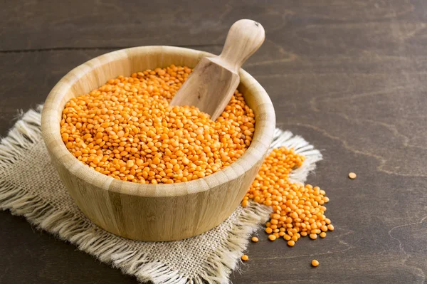 Red dry lentils in a bamboo bowl