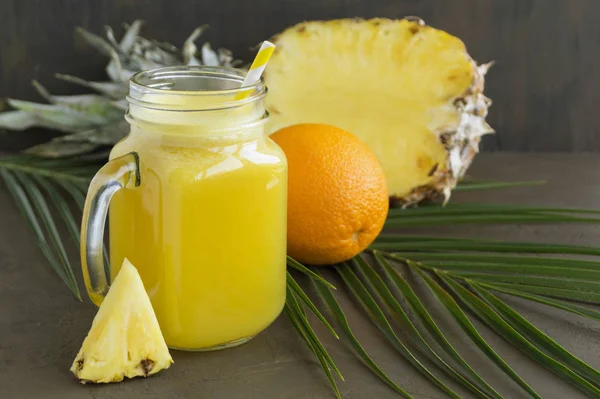 Pineapple juice in a jar with a straw. — Stock Photo, Image