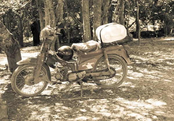 old vintage motorbike in a field