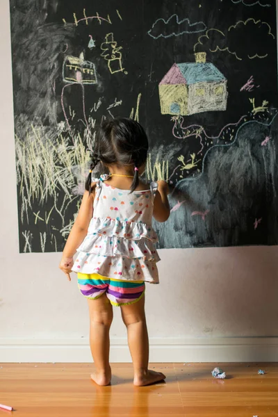 Baby Girl Pupil Draws Chalk Blackboard Stock Image