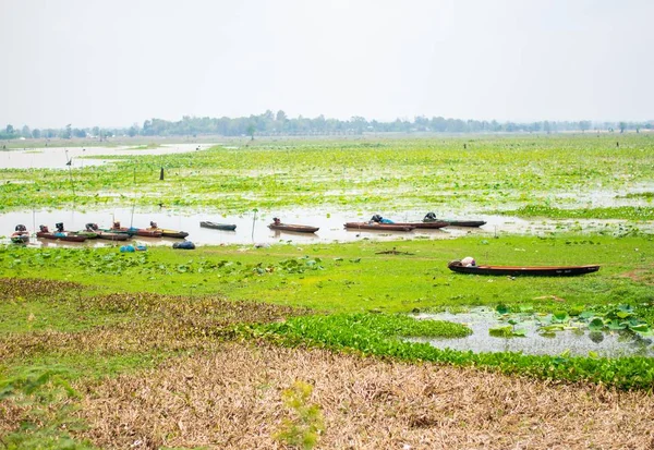 landscape view of river with fishing boat in thailand