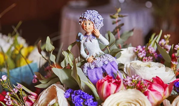 Statuette of flower fairy inside birthday bouquet