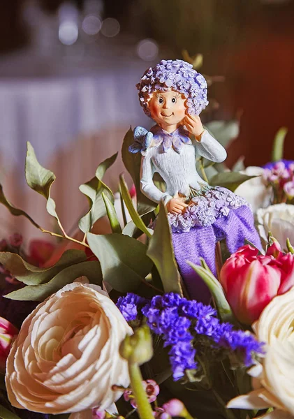 Statuette of flower fairy inside birthday bouquet