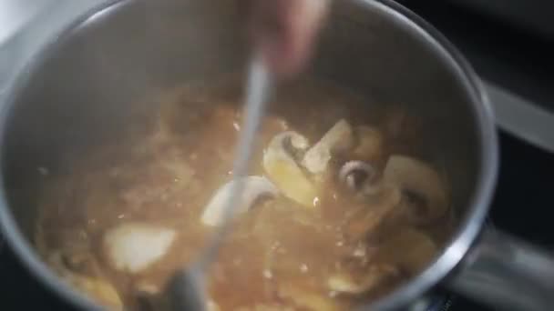 Making soup with octopus and champignons in restaurant — Stock Video