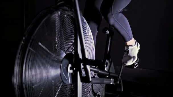 Woman Legs White Sneakers Using Bicycle Machine Dark Gym Concept — Stock Video