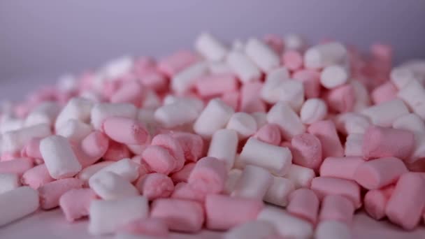 Marshmallow różowe i białe cukierki obracanie tła — Wideo stockowe